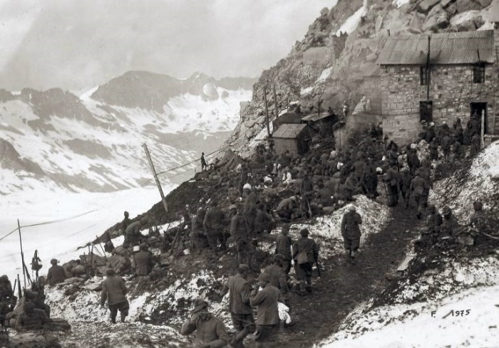 Italian troops congregate around a mountain refuge
