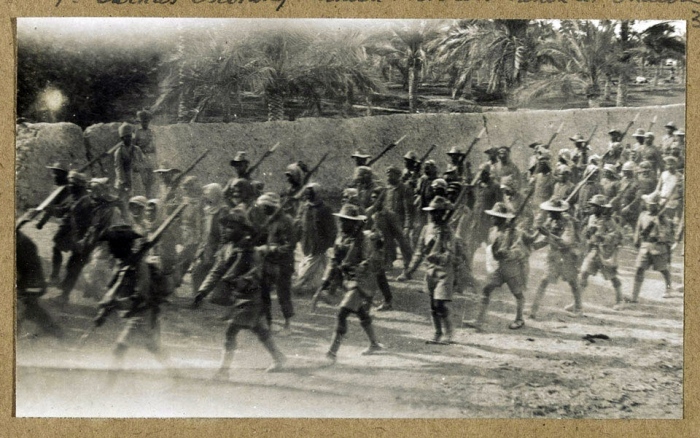 7th Gurkha Rifles escorting Turkish prisoners captured at the Battle of Shaiba, 1915.jpg