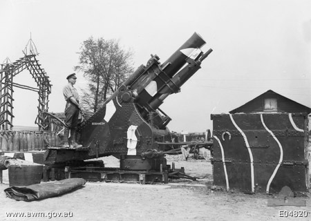 22a An unidentified British soldier standing with a 9.2 inch howitzer Mk I