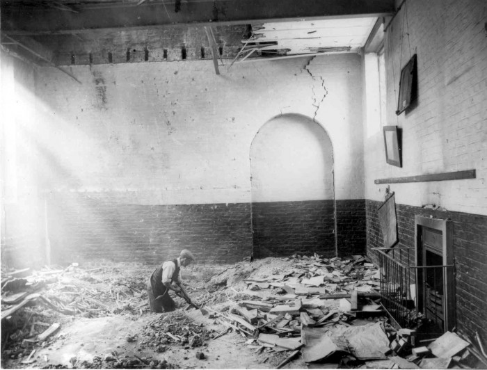Cleaning the debris in a classroom of Upper North Street school after the raid on the 13 Jun 1917