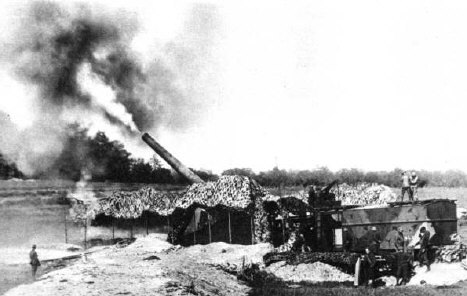 22.7.a Artillery Unit firing shells