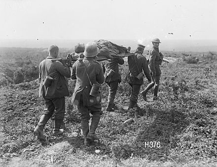 28.8b German_prisoners_carrying_wounded_NZ_soldier,_27_August_1918